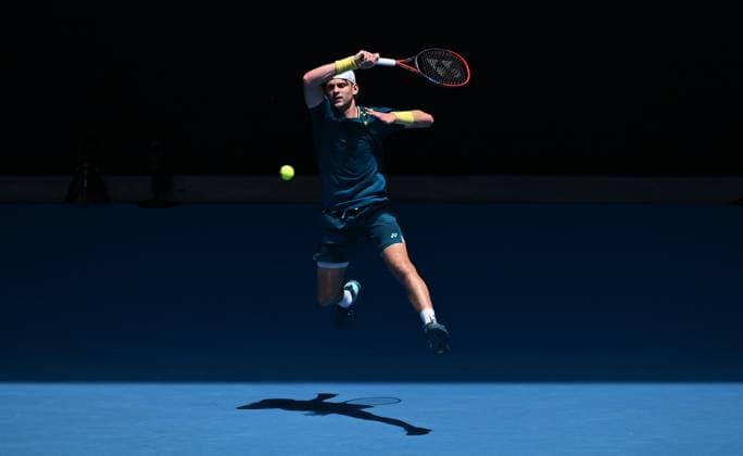 TENNIS AUSTRALIAN OPEN, Zizou Bergs of Belgium returns during his first round match against Stefanos Tsitsipas of Greece on Day 2 of the 2024 Australian Open at Melbourne Park in Melbourne, Monday, January 15, 2024. ( NO ARCHIVING, EDITORIAL USE ONLY, NO USE IN BOOKS WITHOUT CONSENT MELBOURNE VICTORIA AUSTRALIA  Copyright: xJOELxCARRETTx 20240115001889200424