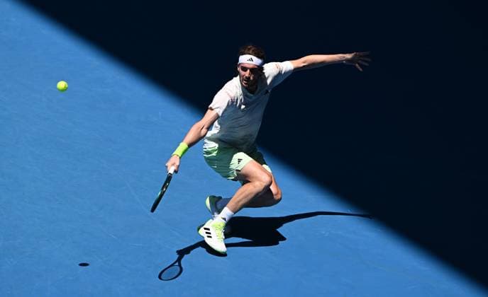TENNIS AUSTRALIAN OPEN, Stefanos Tsitsipas of Greece returns during his first round match against Zizou Bergs of Belgium on Day 2 of the 2024 Australian Open at Melbourne Park in Melbourne, Monday, January 15, 2024. ( NO ARCHIVING, EDITORIAL USE ONLY, NO USE IN BOOKS WITHOUT CONSENT MELBOURNE VICTORIA AUSTRALIA  Copyright: xJOELxCARRETTx 20240115001889213514