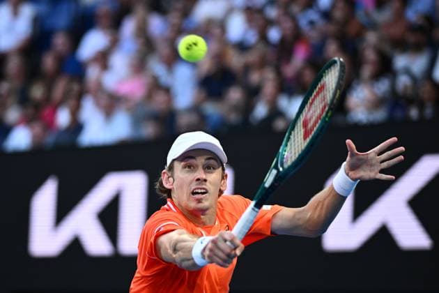 TENNIS AUSTRALIAN OPEN, Alex De Minaur of Australia returns during his first round match against Milos Raonic of Canada on Day 2 of the 2024 Australian Open at Melbourne Park in Melbourne, Monday, January 15, 2024. ( NO ARCHIVING, EDITORIAL USE ONLY, NO USE IN BOOKS WITHOUT CONSENT MELBOURNE VICTORIA AUSTRALIA  Copyright: xJOELxCARRETTx 20240115001889273875
