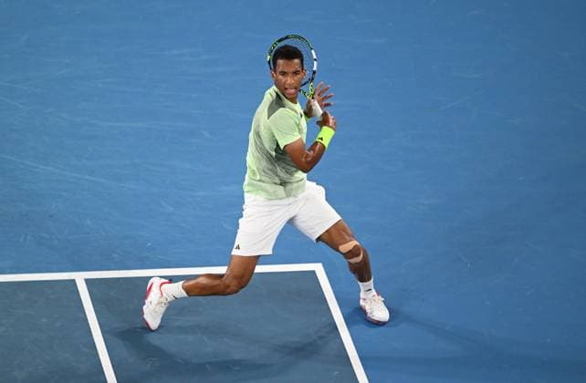 TENNIS AUSTRALIAN OPEN, Felix Auger-Aliassime of Canada in action during his first round match against Domonic Thiem of Austria on Day 2 of the 2024 Australian Open at Melbourne Park in Melbourne, Monday, January 15, 2024. ( NO ARCHIVING, EDITORIAL USE ONLY, NO USE IN BOOKS WITHOUT CONSENT MELBOURNE VICTORIA AUSTRALIA  Copyright: xLUKASxCOCHx 20240115001889281918