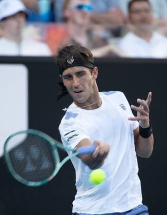 (240115) -- MELBOURNE, Jan. 15, 2024 -- Tomas Martin Etcheverry of Argentina hits a return during the men s singles first round match between Andy Murray of Britain and Tomas Martin Etcheverry of Argentina at Australian Open tennis tournament in Melbourne, Australia, Jan. 15, 2024. (Photo by Xinhua) (SP)AUSTRALIA-MELBOURNE-TENNIS-AUSTRALIAN OPEN HuxJingchen 