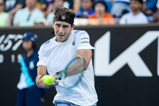 (240115) -- MELBOURNE, Jan. 15, 2024 -- Tomas Martin Etcheverry of Argentina hits a return during the men s singles first round match between Andy Murray of Britain and Tomas Martin Etcheverry of Argentina at Australian Open tennis tournament in Melbourne, Australia, Jan. 15, 2024. (Photo by Xinhua) (SP)AUSTRALIA-MELBOURNE-TENNIS-AUSTRALIAN OPEN HuxJingchen 