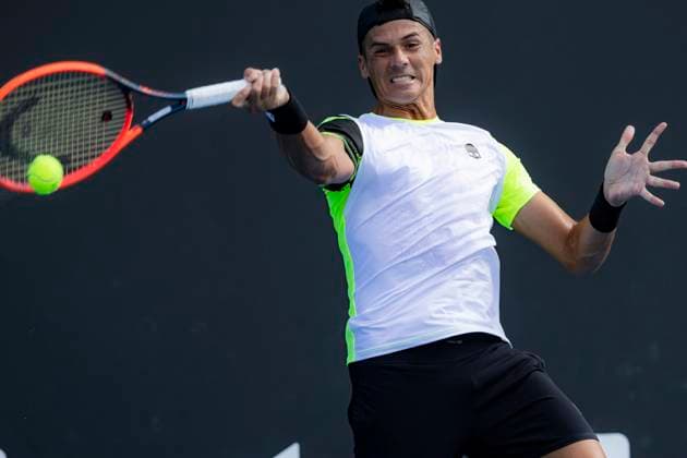 (240115) -- MELBOURNE, Jan. 15, 2024 -- Federico Coria of Argentina hits a return during the men s singles first round match between Zhang Zhizhen of China and Federico Coria of Argentina at Australian Open tennis tournament in Melbourne, Australia, Jan. 15, 2024. (Photo by Xinhua) (SP)AUSTRALIA-MELBOURNE-TENNIS-AUSTRALIAN OPEN ChuxChen 