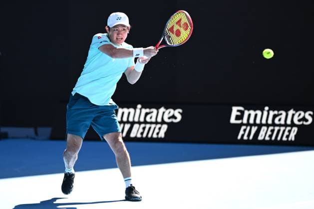 TENNIS AUSTRALIAN OPEN, Yoshihito Nishioka of Japan returns during his round 1 match against Holger Rune of Denmark on Day 3 of the 2024 Australian Open at Melbourne Park in Melbourne, Tuesday, January 16, 2024. ( NO ARCHIVING, EDITORIAL USE ONLY, NO USE IN BOOKS WITHOUT CONSENT MELBOURNE VICTORIA AUSTRALIA  Copyright: xJOELxCARRETTx 20240116001889648148