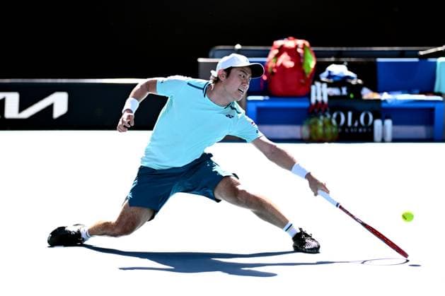 TENNIS AUSTRALIAN OPEN, Yoshihito Nishioka of Japan returns during his round 1 match against Holger Rune of Denmark on Day 3 of the 2024 Australian Open at Melbourne Park in Melbourne, Tuesday, January 16, 2024. ( NO ARCHIVING, EDITORIAL USE ONLY, NO USE IN BOOKS WITHOUT CONSENT MELBOURNE VICTORIA AUSTRALIA  Copyright: xJOELxCARRETTx 20240116001889650609