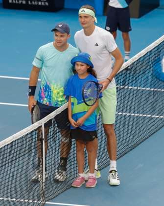 Dominik Koepfer and Alexander Zverev pose at the net for a photo, Australian Open 2024, Melbourne Park, Melbourne, Victoria, Australia Copyright: xJuergenxHasenkopfx