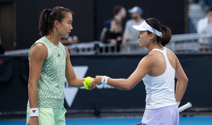 (240117) -- MELBOURNE, Jan. 17, 2024 -- Wang Yafan Yuan Yue (L) of China react during the women s doubles first round match between Wang Yafan Yuan Yue of China and Lucia Bronzetti of Italy Heather Watson of Britain at the Australian Open tennis tournament in Melbourne, Australia on Jan. 17, 2024. (Photo by Xinhua) (SP)AUSTRALIA-MELBOURNE-TENNIS-AUSTRALIAN OPEN HuxJingchen 