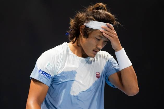 (240118) -- MELBOURNE, Jan. 18, 2024 -- Zhang Zhizhen of China reacts during the men s singles second round match Ugo Humbert of France and Zhang Zhizhen of China at the Australian Open tennis tournament in Melbourne, Australia, Jan. 18, 2024. (Photo by Xinhua) (SP)AUSTRALIA-MELBOURNE-TENNIS-AUSTRALIAN OPEN ChuxChen 