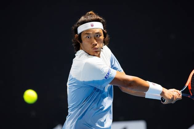 (240118) -- MELBOURNE, Jan. 18, 2024 -- Zhang Zhizhen of China hits a return during the men s singles second round match Ugo Humbert of France and Zhang Zhizhen of China at the Australian Open tennis tournament in Melbourne, Australia, Jan. 18, 2024. (Photo by Xinhua) (SP)AUSTRALIA-MELBOURNE-TENNIS-AUSTRALIAN OPEN ChuxChen 