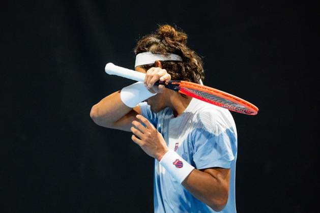(240118) -- MELBOURNE, Jan. 18, 2024 -- Zhang Zhizhen of China reacts during the men s singles second round match Ugo Humbert of France and Zhang Zhizhen of China at the Australian Open tennis tournament in Melbourne, Australia, Jan. 18, 2024. (Photo by Xinhua) (SP)AUSTRALIA-MELBOURNE-TENNIS-AUSTRALIAN OPEN ChuxChen 