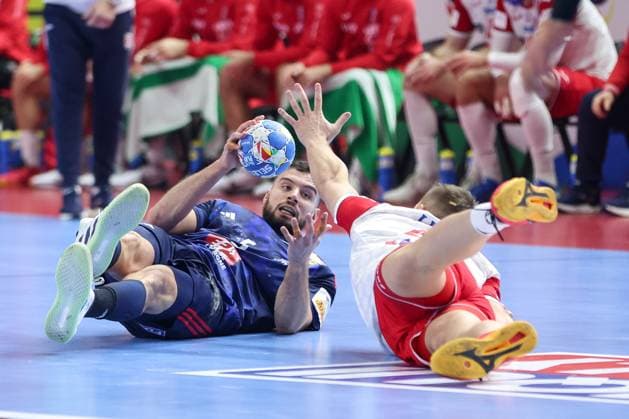 France v Croatia - Men s EHF Euro 2024 COLOGNE, GERMANY - JANUARY 18: Nedim Remili of France and Luka Cindric of Croatia in actionduring the Men s EHF Euro 2024 main round match between Croatia and France at Lanxess Arena on January 18, 2024 in Cologne, Germany. SanjinxStrukic PIXSELL