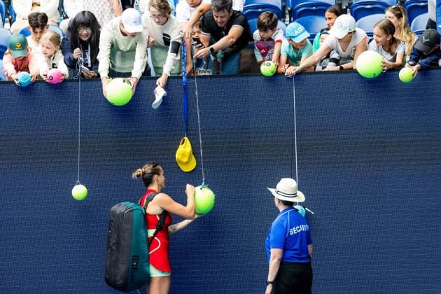 (240119) -- MELBOURNE, Jan. 19, 2024 -- Aryna Sabalenka signs for spectators after the women s singles third round match between Aryna Sabalenka of Belarus and Lesia Tsurenko of Ukraine at the Australian Open tennis tournament in Melbourne, Australia, Jan. 19, 2024. (Photo by Xinhua) (SP)AUSTRALIA-MELBOURNE-TENNIS-AUSTRALIAN OPEN ChuxChen 