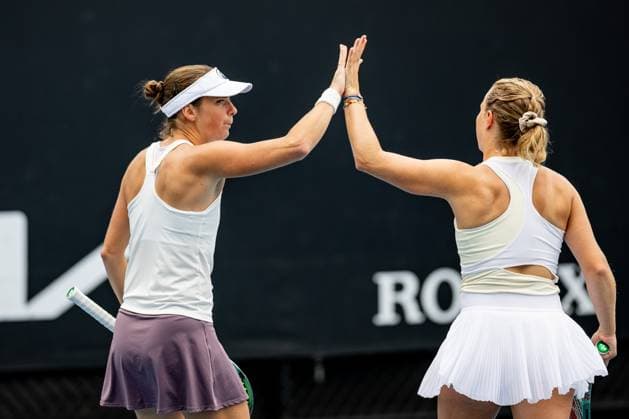 (240119) -- MELBOURNE, Jan. 19, 2024 -- Bibiane Schoofs (L) claps hands with Kimberley Zimmermann during the women s doubles first round match between Bibiane Schoofs of the Netherlands Kimberley Zimmermann of Belgium and Guo Hanyu Jiang Xinyu of China at the Australian Open tennis tournament in Melbourne, Australia, Jan. 19, 2024. (Photo by Xinhua) (SP)AUSTRALIA-MELBOURNE-TENNIS-AUSTRALIAN OPEN ChuxChen 