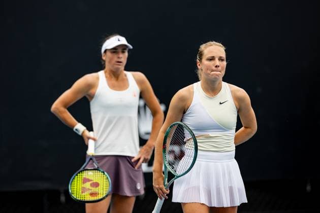(240119) -- MELBOURNE, Jan. 19, 2024 -- Bibiane Schoofs Kimberley Zimmermann(R) react during the women s doubles first round match between Bibiane Schoofs of the Netherlands Kimberley Zimmermann of Belgium and Guo Hanyu Jiang Xinyu of China at the Australian Open tennis tournament in Melbourne, Australia, Jan. 19, 2024. (Photo by Xinhua) (SP)AUSTRALIA-MELBOURNE-TENNIS-AUSTRALIAN OPEN ChuxChen 