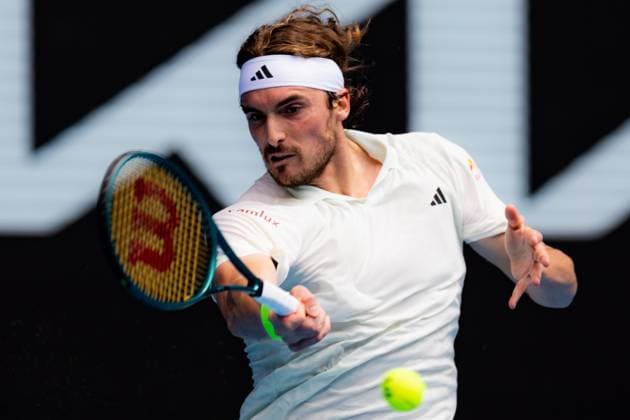 (240119) -- MELBOURNE, Jan. 19, 2024 -- Stefanos Tsitsipas hits a return during the men s singles third round match between Stefanos Tsitsipas of Greece and Luca Van Assche of France at the Australian Open tennis tournament in Melbourne, Australia, Jan. 19, 2024. (Photo by Xinhua) (SP)AUSTRALIA-MELBOURNE-TENNIS-AUSTRALIAN OPEN ChuxChen 
