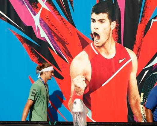 Alexander Zverev GER walks past a Carlos Alcaraz poster after training , Australian Open 2024, Melbourne Park, Melbourne, Victoria, Australia Copyright: xJuergenxHasenkopfx