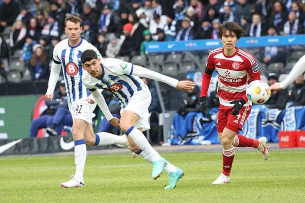 DEU, DFL, 2 FBL, Hertha BSC vs Fortuna Duesseldorf, 21 01 2024, Berliner Olympiastadion, Berlin, DEU, DFL, 2 FBL, Hertha BSC vs Fortuna Duesseldorf, in the picture Andreas Bouchalakis Hertha BSC Berlin 5 , Pascal Klemens Hertha BSC Berlin 41 ,Ao Tanaka Fortuna Duesseldorf 4 DFL regulations prohibit any use of Photographs as image sequences and or quasi video Foto Juergen Engler nordphoto GmbH nordphotoxGmbHx xEngler nph00076