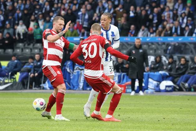 DEU, DFL, 2 FBL, Hertha BSC vs Fortuna Duesseldorf, 21 01 2024, Berliner Olympiastadion, Berlin, DEU, DFL, 2 FBL, Hertha BSC vs Fortuna Duesseldorf, in the picture Derry Scherhant Hertha BSC Berlin 39 , T Jordy de Wijs Fortuna Duesseldorf 30 , Andre Hoffmann Fortuna Duesseldorf 3 DFL regulations prohibit any use of Photographs as image sequences and or quasi video Foto Juergen Engler nordphoto GmbH nordphotoxGmbHx xEngler nph00076