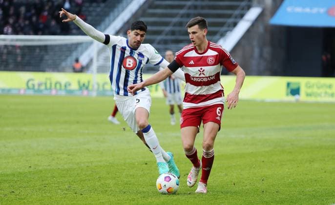 Andreas Bouchalakis, Yannik Engelhardt duel match scene action sport soccer soccer DFL 2 Bundesliga Men 18 Matchday Season 2023 2024 21 01 2024 Hertha BSC Berlin vs Fortuna Düsseldorf DFL regulations prohibit any use of photographs as image sequences and or quasi video