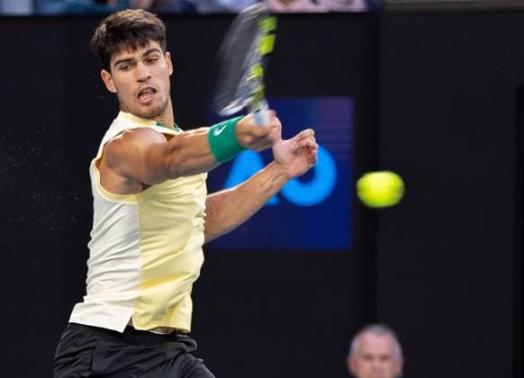 (240122) -- MELBOURNE, Jan. 22, 2024 -- Carlos Alcaraz competes during the men s singles 4th round match between Carlos Alcaraz of Spain and Miomir Kecmanovic of Serbia at Australian Open tennis tournament in Melbourne, Australia, Jan. 22, 2024. (Photo by Xinhua) (SP)AUSTRALIA-MELBOURNE-TENNIS-AUSTRALIAN OPEN-DAY 9 HuxJingchen 