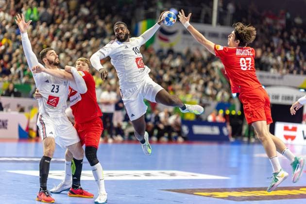 Handball I Men I Euro 2024 I Main round I Group 1 I France Austria I 22 01 2024 Dika Mem 11, France Jump shot Michael Miskovez 97, Austria tries to block Cologne Lanxess Arena NRW Germany Copyright: xLobeca PatrickxSuephkex