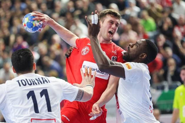 Handball, EM 2024 in Deutschland, Die Highlights France v Austria - Men s EHF Euro 2024 COLOGNE, GERMANY - JANUARY 22: Mykola Bilyk of Austria is challenged by Karl Konan of France during the Men s EHF Euro 2024 main round match between France and Austria at Lanxess Arena on January 22, 2024 in Cologne, Germany. SanjinxStrukic PIXSELL