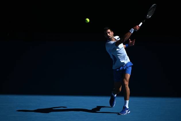 TENNIS AUSTRALIAN OPEN, Novak Djokovic of Serbia plays a return shot during his quarter final match against Taylor Fritz of the USA on Day 10 of the 2024 Australian Open at Melbourne Park in Melbourne, Tuesday, January 23, 2024. ( NO ARCHIVING, EDITORIAL USE ONLY, NO USE IN BOOKS WITHOUT CONSENT MELBOURNE VICTORIA AUSTRALIA  Copyright: xJAMESxROSSx 20240123001892524555