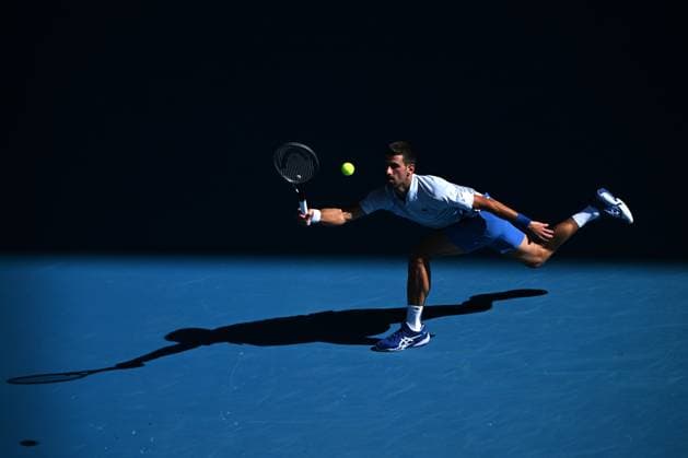 TENNIS AUSTRALIAN OPEN, Novak Djokovic of Serbia plays a return shot during his quarter final match against Taylor Fritz of the USA on Day 10 of the 2024 Australian Open at Melbourne Park in Melbourne, Tuesday, January 23, 2024. ( NO ARCHIVING, EDITORIAL USE ONLY, NO USE IN BOOKS WITHOUT CONSENT MELBOURNE VICTORIA AUSTRALIA  Copyright: xJAMESxROSSx 20240123001892524738