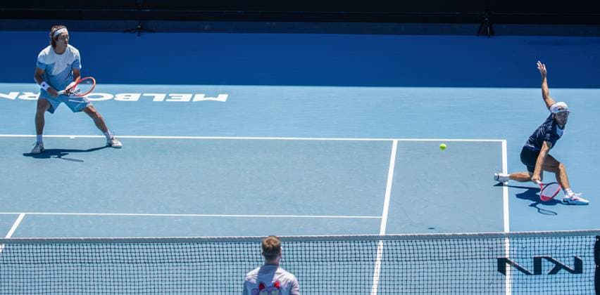 (240123) -- MELBOURNE, Jan. 23, 2024 -- Zhang Zhizhen Tomas Machac (R) compete during the men s doubles quarterfinal between Zhang Zhizhen (China) Tomas Machac (the Czech Republic) and Ariel Behar (Uruguay) Adam Pavlasek (the Czech Republic) at the Australian Open tennis tournament in Melbourne, Australia, Jan. 23, 2024. (Photo by Xinhua) (SP)AUSTRALIA-MELBOURNE-TENNIS-AUSTRALIAN OPEN HuxJingchen 