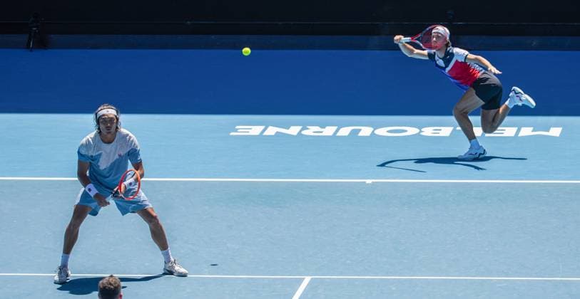 (240123) -- MELBOURNE, Jan. 23, 2024 -- Zhang Zhizhen Tomas Machac (R) compete during the men s doubles quarterfinal between Zhang Zhizhen (China) Tomas Machac (the Czech Republic) and Ariel Behar (Uruguay) Adam Pavlasek (the Czech Republic) at the Australian Open tennis tournament in Melbourne, Australia, Jan. 23, 2024. (Photo by Xinhua) (SP)AUSTRALIA-MELBOURNE-TENNIS-AUSTRALIAN OPEN HuxJingchen 