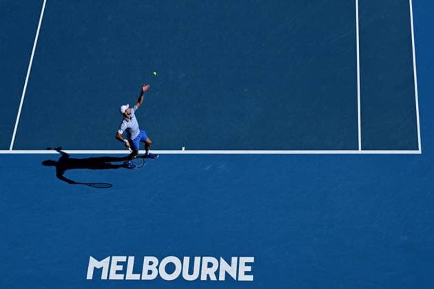 TENNIS AUSTRALIAN OPEN, Novak Djokovic of Serbia serves during his quarter final match against Taylor Fritz of the USA on Day 10 of the 2024 Australian Open at Melbourne Park in Melbourne, Tuesday, January 23, 2024. ( NO ARCHIVING, EDITORIAL USE ONLY, NO USE IN BOOKS WITHOUT CONSENT MELBOURNE VICTORIA AUSTRALIA  Copyright: xJAMESxROSSx 20240123001892530439