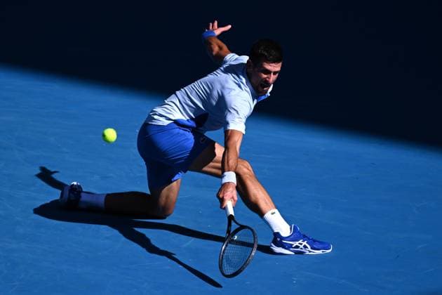 TENNIS AUSTRALIAN OPEN, Novak Djokovic of Serbia plays a return shot during his quarter final match against Taylor Fritz of the USA on Day 10 of the 2024 Australian Open at Melbourne Park in Melbourne, Tuesday, January 23, 2024. ( NO ARCHIVING, EDITORIAL USE ONLY, NO USE IN BOOKS WITHOUT CONSENT MELBOURNE VICTORIA AUSTRALIA  Copyright: xJOELxCARRETTx 20240123001892536938