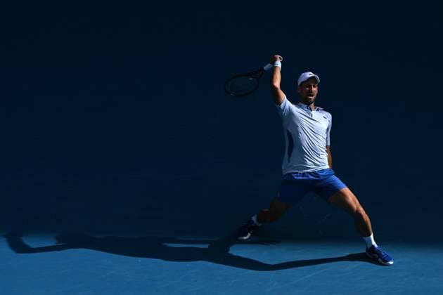 TENNIS AUSTRALIAN OPEN, Novak Djokovic of Serbia plays a return shot during his quarter final match against Taylor Fritz of the USA on Day 10 of the 2024 Australian Open at Melbourne Park in Melbourne, Tuesday, January 23, 2024. ( NO ARCHIVING, EDITORIAL USE ONLY, NO USE IN BOOKS WITHOUT CONSENT MELBOURNE VICTORIA AUSTRALIA  Copyright: xJAMESxROSSx 20240123001892541018