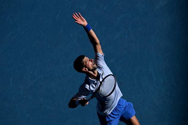 TENNIS AUSTRALIAN OPEN, Novak Djokovic of Serbia serves during his quarter final match against Taylor Fritz of the USA on Day 10 of the 2024 Australian Open at Melbourne Park in Melbourne, Tuesday, January 23, 2024. ( NO ARCHIVING, EDITORIAL USE ONLY, NO USE IN BOOKS WITHOUT CONSENT MELBOURNE VICTORIA AUSTRALIA  Copyright: xJAMESxROSSx 20240123001892542789