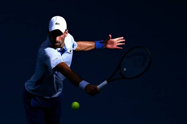TENNIS AUSTRALIAN OPEN, Novak Djokovic of Serbia plays a return shot during his quarter final match against Taylor Fritz of the USA on Day 10 of the 2024 Australian Open at Melbourne Park in Melbourne, Tuesday, January 23, 2024. ( NO ARCHIVING, EDITORIAL USE ONLY, NO USE IN BOOKS WITHOUT CONSENT MELBOURNE VICTORIA AUSTRALIA  Copyright: xJOELxCARRETTx 20240123001892547259