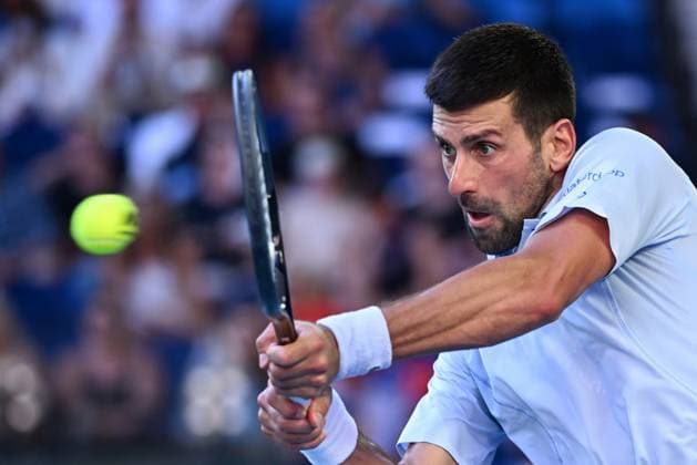 TENNIS AUSTRALIAN OPEN, Novak Djokovic of Serbia plays a return shot during his quarter final match against Taylor Fritz of the USA on Day 10 of the 2024 Australian Open at Melbourne Park in Melbourne, Tuesday, January 23, 2024. ( NO ARCHIVING, EDITORIAL USE ONLY, NO USE IN BOOKS WITHOUT CONSENT MELBOURNE VICTORIA AUSTRALIA  Copyright: xJOELxCARRETTx 20240123001892554389