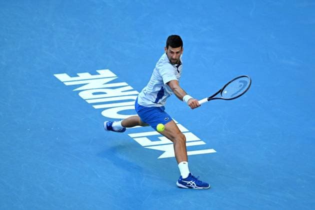 TENNIS AUSTRALIAN OPEN, Novak Djokovic of Serbia plays a return shot during his quarter final match against Taylor Fritz of the USA on Day 10 of the 2024 Australian Open at Melbourne Park in Melbourne, Tuesday, January 23, 2024. ( NO ARCHIVING, EDITORIAL USE ONLY, NO USE IN BOOKS WITHOUT CONSENT MELBOURNE VICTORIA AUSTRALIA  Copyright: xLUKASxCOCHx 20240123001892556193