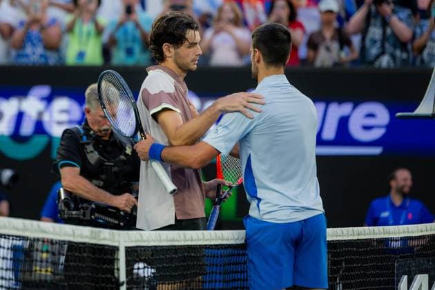 (240123) -- MELBOURNE, Jan. 23, 2024 -- Novak Djokovic (R) greets Taylor Fritz after the men s singles quarterfinal match between Novak Djokovic of Serbia and Taylor Fritz of the United States at Australian Open tennis tournament in Melbourne, Australia, Jan. 23, 2024. (Photo by Xinhua) (SP)AUSTRALIA-MELBOURNE-TENNIS-AUSTRALIAN OPEN ChuxChen 