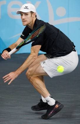 Belgian Joris De Loore pictured in action during a tennis match against Hungarian Piros, in the first round of the men s singles at the BW Open ATP, Tennis Herren Challenger 125 tournament, in Louvain-la-Neuve, Tuesday 23 January 2024. THE BW Open takes place from 22 to 28 January. BENOITxDOPPAGNE  x84515790x
