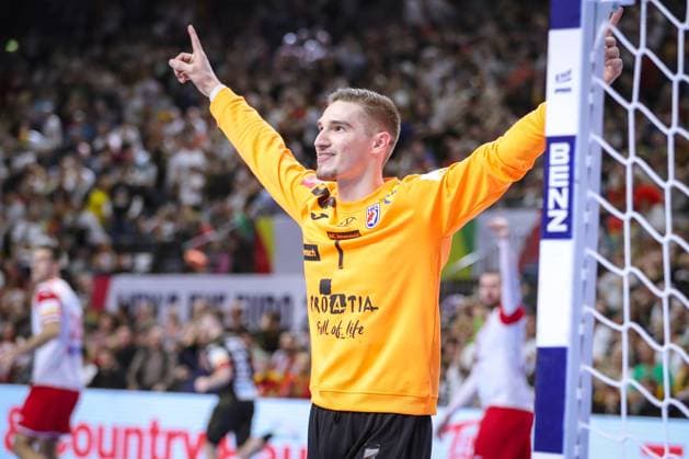 24 01 2024, EHF EURO 2024, European Mens Handball Championship, Lanxess Arena in Cologne, Germany Croatia Goalkeeper Dominik Kuzmanovic Croatia stands cheering in goal North Rhine-Westphalia Germany