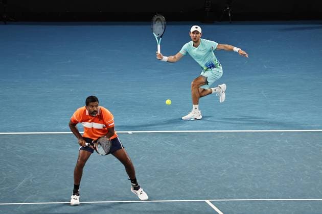 Rohan Bopanna orange , IND, and Matthew Ebden, AUS, during mens doubles of 2024 Australian Open in Melbourne, 25 01 2023