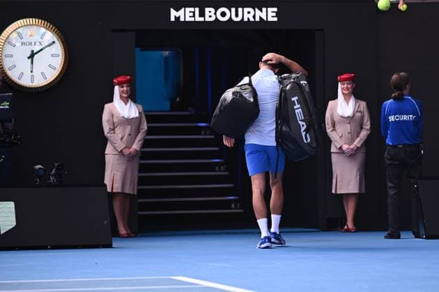 TENNIS AUSTRALIAN OPEN, Novak Djokovic of Serbia leaves the court following his loss in the Men?s semifinal to Jannik Sinner of Italy on Day 13 of the 2024 Australian Open at Melbourne Park in Melbourne, , Friday, January 26, 2024. ( NO ARCHIVING, EDITORIAL USE ONLY, NO USE IN BOOKS WITHOUT CONSENT MELBOURNE VICTORIA AUSTRALIA  Copyright: xJOELxCARRETTx 20240126001893792170