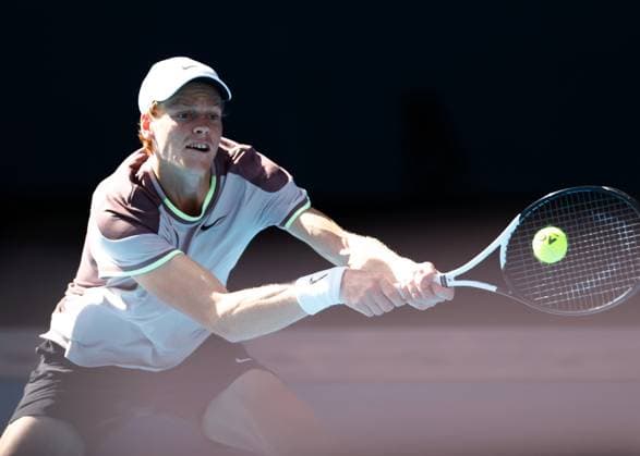 (240126) -- MELBOURNE, Jan. 26, 2024 -- Jannik Sinner of Italy hits a return during his men s singles semifinal against Novak Djokovic of Serbia at Australian Open tennis tournament in Melbourne, Australia, Jan. 26, 2024. (Photo by Xinhua) (SP)AUSTRALIA-MELBOURNE-TENNIS-AUSTRALIAN OPEN-MEN S SINGLES SEMIFINALS ChuxChen 