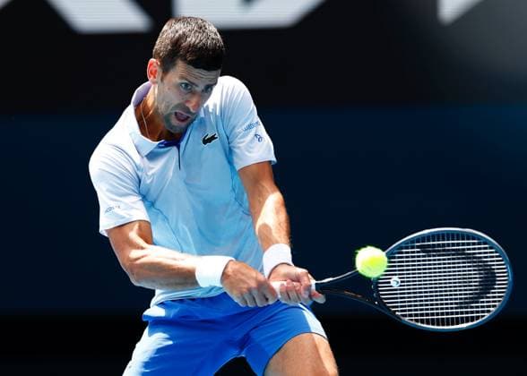 (240126) -- MELBOURNE, Jan. 26, 2024 -- Novak Djokovic of Serbia hits a return during his men s singles semifinal against Jannik Sinner of Italy at Australian Open tennis tournament in Melbourne, Australia, Jan. 26, 2024. (Photo by Xinhua) (SP)AUSTRALIA-MELBOURNE-TENNIS-AUSTRALIAN OPEN-MEN S SINGLES SEMIFINALS ChuxChen 
