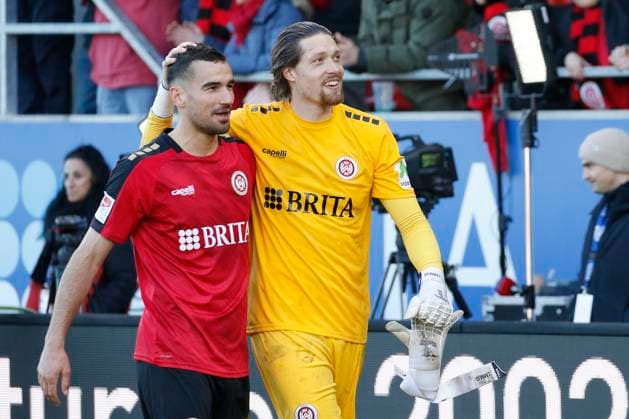 27 01 2024, xavx, Soccer 2 Bundesliga, SV Wehen Wiesbaden Hertha BSC Berlin emspor, v l Ivan Prtajin SV Wehen Wiesbaden , Goalkeeper Florian Stritzel SV Wehen Wiesbaden cheers after the match DFL DFB REGULATIONS PROHIBIT ANY USE OF PHOTOGRAPHS as IMAGE SEQUENCES and or QUASI VIDEO Wiesbaden