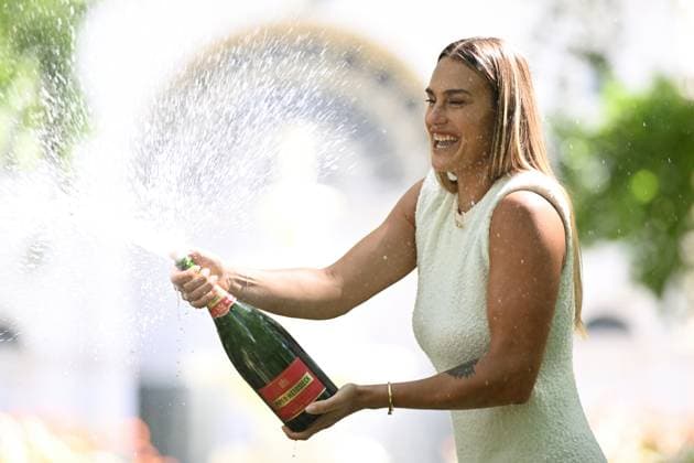 TENNIS AUSTRALIAN OPEN, Aryna Sabalenka of Belarus sprays Champagne after posing for a photo with the Daphne Akhurst Memorial Cup following her win over Qinwen Zheng of China in the Women?s Singles Final at the 2024 Australian Open tennis tournament in Melbourne, Sunday, January 28, 2024. ( NO ARCHIVING, EDITORIAL USE ONLY, NO USE IN BOOKS WITHOUT CONSENT MELBOURNE VICTORIA AUSTRALIA  Copyright: xJOELxCARRETTx 20240128001894573883