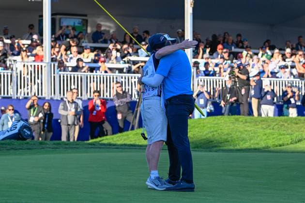 LA JOLLA, CA - JANUARY 27: Matthieu Pavon (FRA) celebrates with his caddie after winning the Farmers Insurance Open at Torrey Pines Golf Course on January 27, 2024, in La Jolla, California. (Photo by Ken Murray Icon Sportswire) GOLF: JAN 27 PGA, Golf Herren Farmers Insurance Open EDITORIAL USE ONLY Icon2401270064