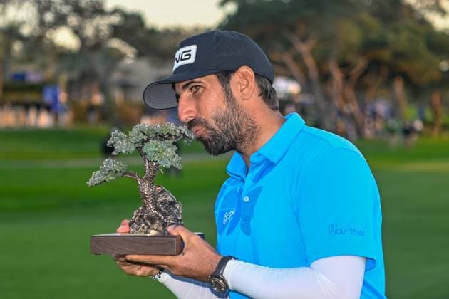 LA JOLLA, CA - JANUARY 27: Matthieu Pavon (FRA) holds the trophy for winning the Farmers Insurance Open at Torrey Pines Golf Course on January 27, 2024, in La Jolla, California. (Photo by Ken Murray Icon Sportswire) GOLF: JAN 27 PGA, Golf Herren Farmers Insurance Open EDITORIAL USE ONLY Icon2401270174