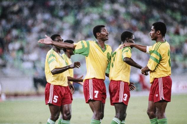 Bari, Italy. Cameroon players defenceman Bertin Ebwelle, forward Francois Omam-Biyik, defenceman Jules Denis Onana and defenceman Andre Kana-Biyik (L-R front) explain to each other the situation on the field during the group stage match of the 1990 FIFA World Cup, WM, Weltmeisterschaft, Fussball between the national teams of the Soviet Union and Cameroon at the San Nicola stadium - 4:0. Igor Utkin TASS  22555717