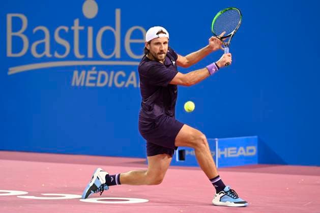 MONTPELLIER, FRANCE - JANUARY 30 : Lucas POUILLE (FRA) during the 1st round of the ATP, Tennis Herren 250 Open Sud de France tournament vs. Harold MAYOT (FRA) in Montpellier, France on January 30th, 2024. TENNIS : Open Sud de France ATP 250 - 30 01 2024 ValentinaClaret Panoramic 